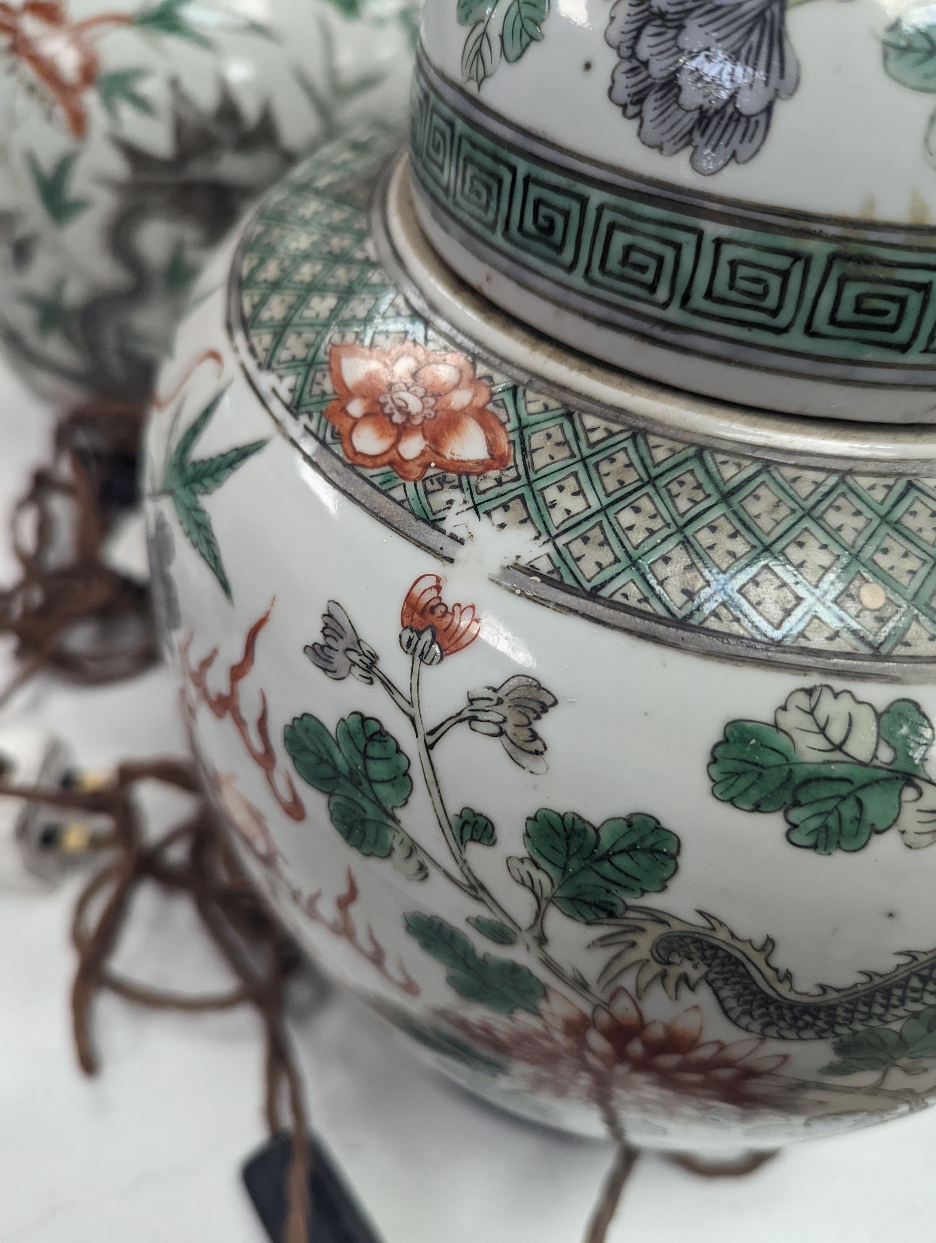 A pair of 19th century Chinese famille verte’dragon’ jars and covers (drilled and converted to lamps) - 53cm high